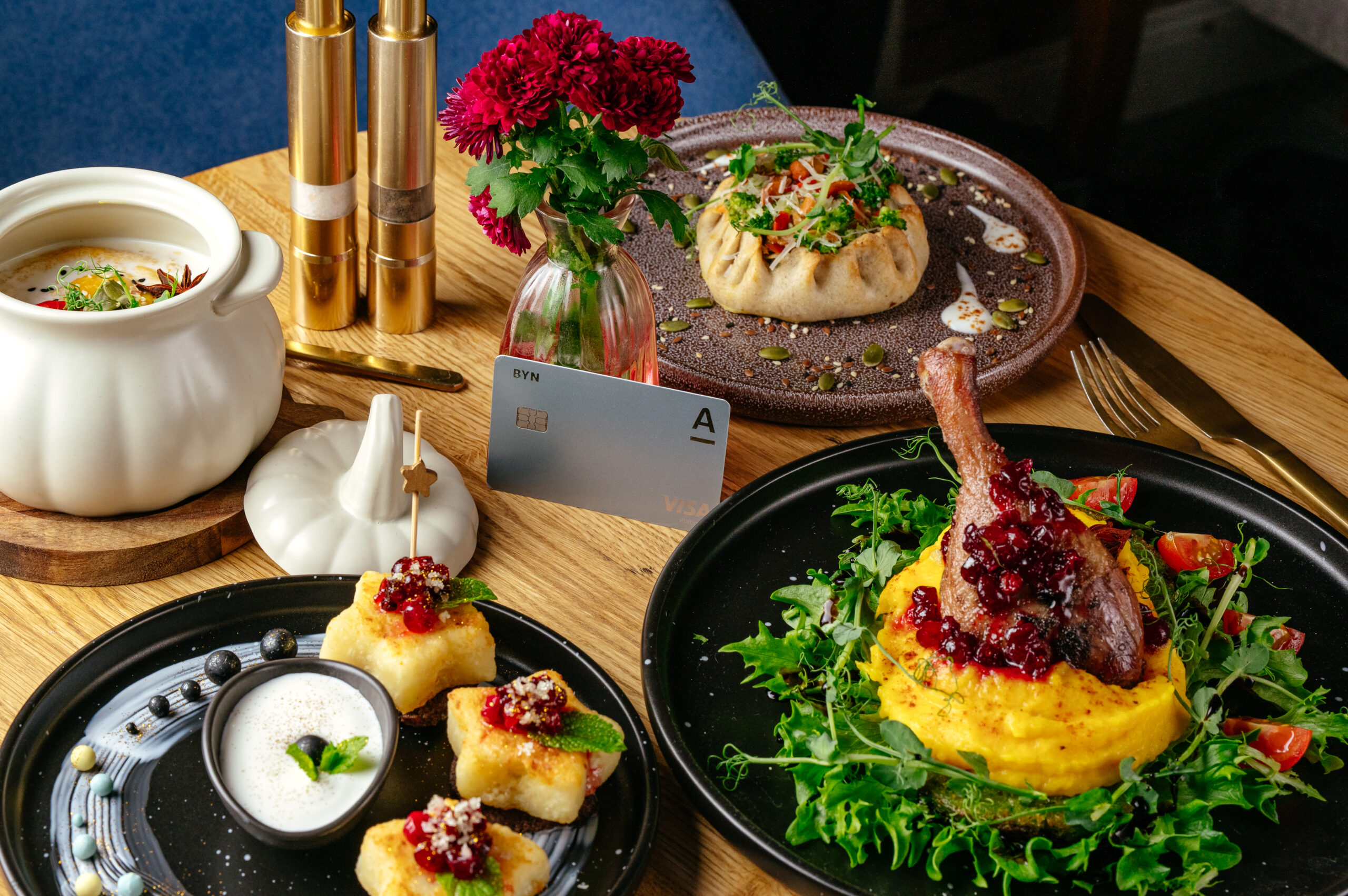 Gourmet dining experience with diverse dishes credit card restaurant table scaled