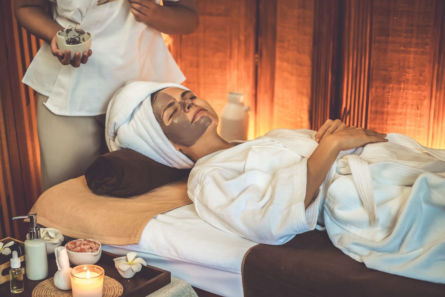 Serene ambiance spa salon woman customer indulges rejuvenating with charcoal face cream massage with warm lighting candle facial skin treatment beauty care concept quiescent 1536x1024